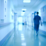 Hospital corridor and doctor as a blurred defocused background