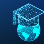 Graduation cap or mortar board on top of world globe. education